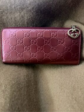 Gucci Patent Leather GG Embossed Zip Wallet in Deep Berry. GG Heart Zipper Pull.